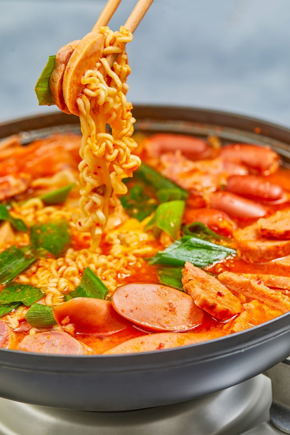 Budaejjigae combines foreign-based ingredients like ham and sausage to a traditional Korean stew that includes red pepper powder and kimchi. (Courtesy of gettyimagesbank)