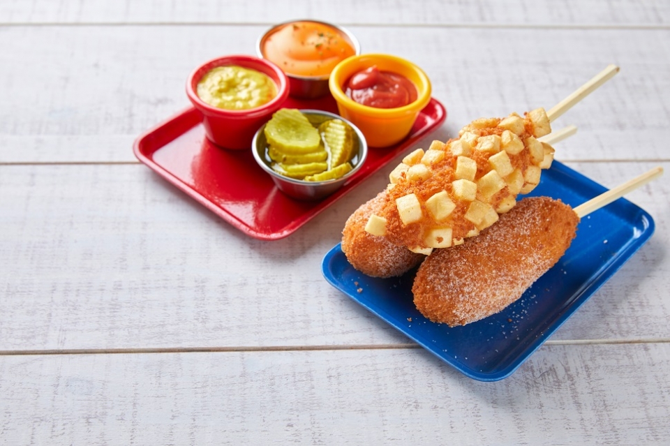 Korean-style corn dogs are covered with sugar and sometimes feature diced potatoes on the outside. (Courtesy of gettyimagesbank)